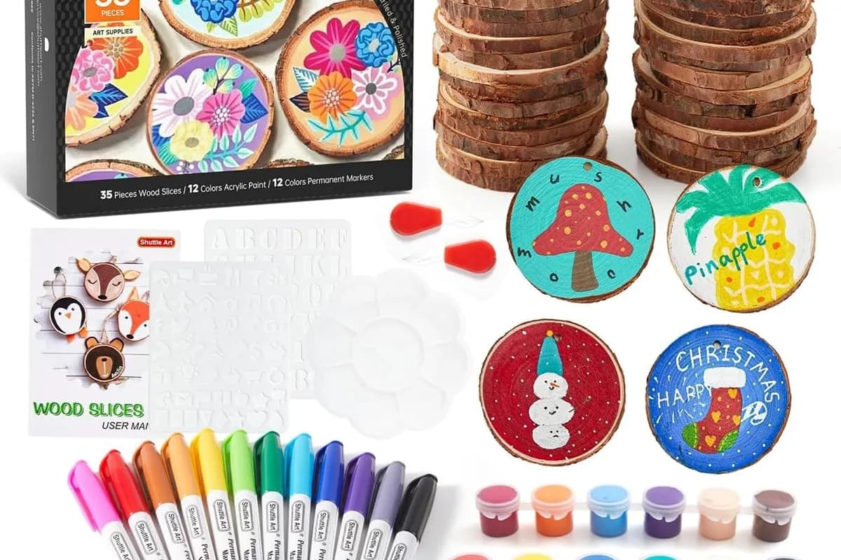 A craft kit of unfinished wooden slices with acrylic paints, markers and twine for making ornaments