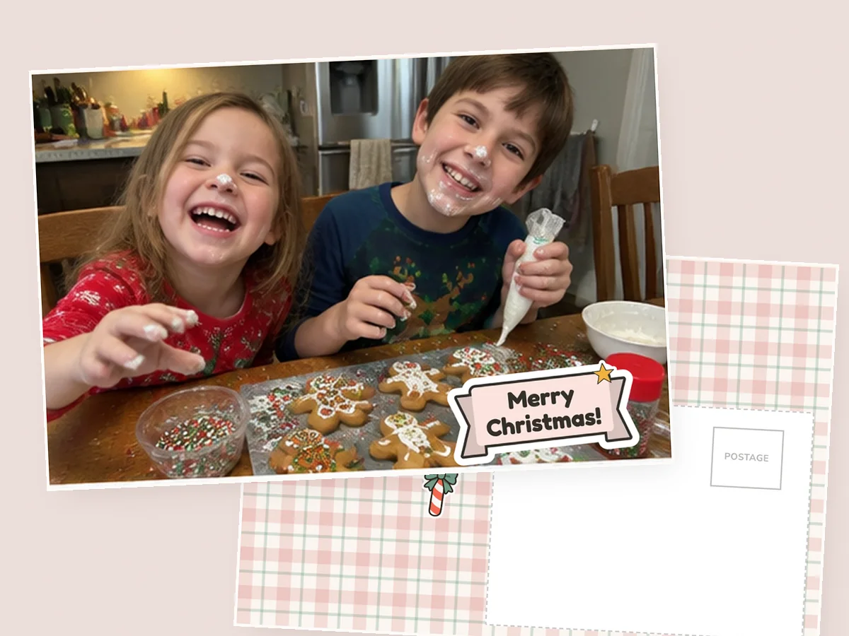 A printed 4×6 postcard front of two kids icing gingerbread with a Merry Christmas sticker, its plaid message side underneath