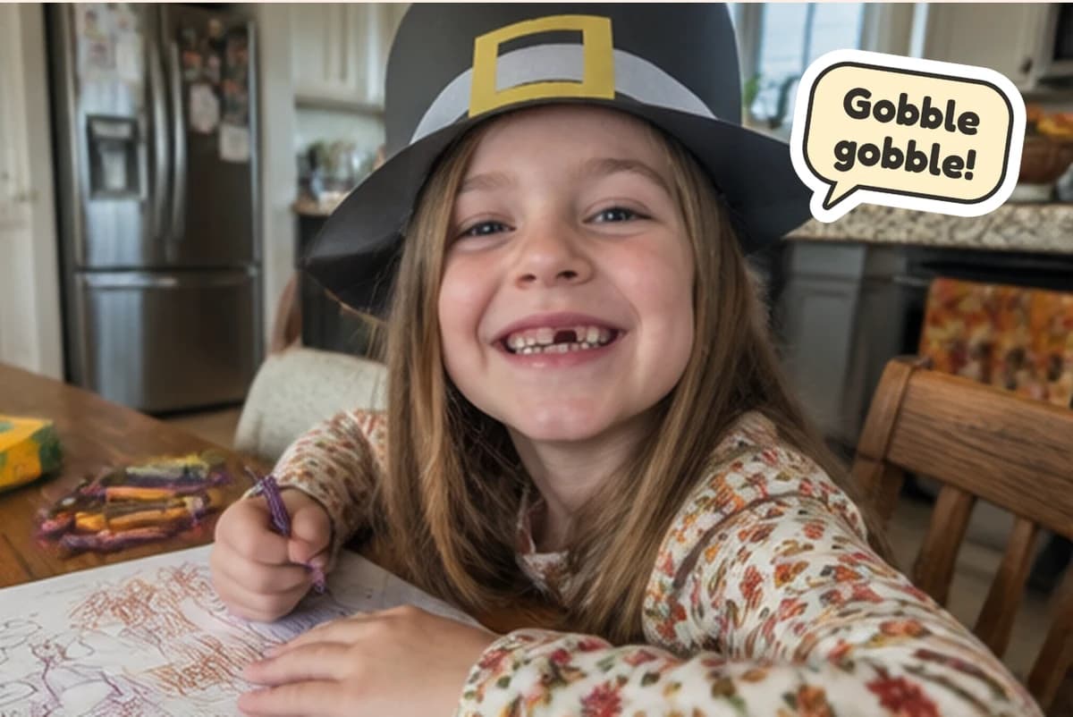 Card front with one full-size photo of a grinning girl in a paper pilgrim hat she made, with a Gobble gobble! sticker